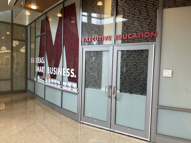 A photo of the entrance to the MIT Sloan Executive Education suite.